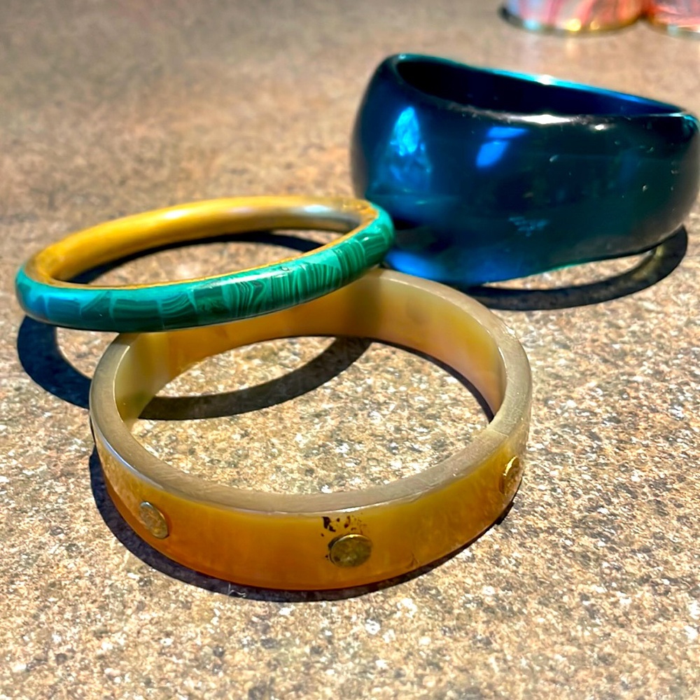 Three bangle bracelets- wide blue, green and brown.